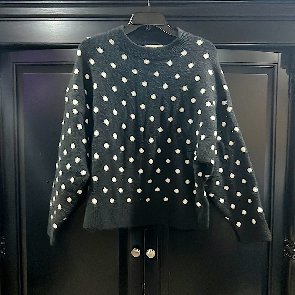 Black sweater with white polka dots